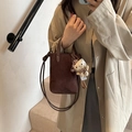 Brown matte crossbody bag with animal print plush charm accessory and thin strap - Coffee without Pendant