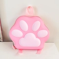 Detailed view of pink cat paw shaped hardshell backpack with embossed 3D padded details - Pink