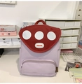 Detail of cute purple mushroom backpack with red dot lid and side pockets on a desk - Without Pendant / Purple