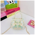 Detail of light blue embroidered child bag with traditional knots and pearl handle - Green With Frog Buttons