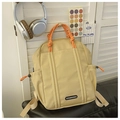 Lightweight beige drawstring kids backpack with orange handle and fashion label - Small / Khaki