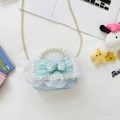 Light blue lace crossbody bag for girls featuring a large bow and pearl handle detail - Blue Bow