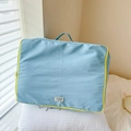 Light blue large capacity kids travel bag with yellow zipper on white pillow - Blue