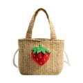 Beige woven straw handbag for kids featuring a cute red 3D strawberry plush charm - Khaki Strawberry