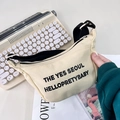 Cream canvas crossbody bag for kids with black letter print and adjustable strap - White