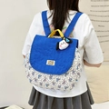 Quilted blue child backpack with floral pattern and cute white puppy plush charm - Small / Blue