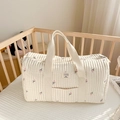 Quilted diaper bag with pink floral patterns and a front pocket in cream beige finish - White Tulip