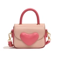 Pink and peach heart-shaped girls handbag with adjustable strap and golden hardware - Pink