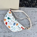 White nylon kids chest bag with colorful dinosaur prints and adjustable strap - Beige