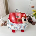 Quilted kids backpack featuring red checkered fabric and cute plush dog charm detail - Small / Red