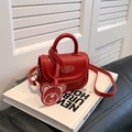 Red mini crossbody bag for girls featuring a cute bear pendant and top round handle - Red