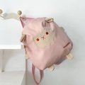 Pink canvas kids backpack featuring cute cartoon animal patch and large capacity - Pink