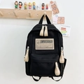 Mochila escolar minimalista de lona negra con etiqueta de moda y cremalleras beige - Negro