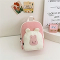 Pink and beige canvas child backpack featuring a cute cartoon rabbit patch design - Pink