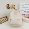 Creamy nylon backpack for toddlers featuring Girl Cats label and front pocket - White