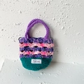 Handmade crochet floral bag in purple and pink yarn with dark green bottom base - Colorful Thread