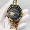 Detail of Junming automatic mechanical watch with skeleton dial and two-tone steel band - Two-tone Black Dial