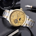 Close-up of golden automatic mechanical watch dial with Roman numerals and steel strap - Two-tone Gold Dial