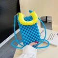 Minibolso de cuentas azules para niñas con un asa amarilla acolchada contrastada - Azul