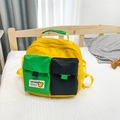 Gele canvas kinderrugzak met groen contrast en op Kaws geïnspireerd cartoon-personage - Geel