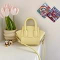 Pale yellow leather mini handbag for girls featuring litchi texture and crossbody strap - Yellow