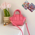Pink mini luggage handbag for girls featuring litchi texture and adjustable strap - Pink