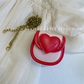 Pink heart-shaped girl's crossbody bag with red trim and golden chain strap - Pink