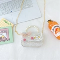 White tweed girls handbag with pearl handle and pink bow on a clean creative desk - Style 1 White
