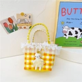 Orange and yellow checkered straw handbag with lace trim and a cute plush bunny doll - Orange