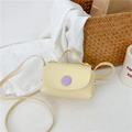 Mini cream PU crossbody bag for girls featuring a stylish purple circular buckle detail - Yellow