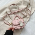 Pink mini crossbody handbag for girls with cute 3D bunny embossments and a charm - Pink
