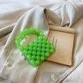 Mini green beaded handbag for girls with pearl handle and acrylic resin woven design - Green