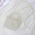 Miniature white pearl crossbody bag for girls featuring a beaded handle and long strap - Small