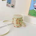 Mini cylindrical shoulder bag for girls with red cherry print and golden zipper detail - Yellow