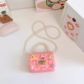Pink silicone jelly bag for girls featuring pearl handle and cute cartoon charms - Pink
