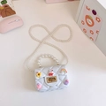 White mini quilted jelly bag for girls with pearl handle and cute cartoon charms - White