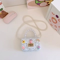 White mini cartoon jelly bag for girls with cute floral charms and pearl handle strap - White