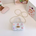 Mini borsa jelly bianca trapuntata con graziosi ciondoli e tracolla di perle - Bianco