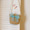 Light brown straw shoulder bag with large light blue tulle bow and pearl accents - Khaki with Blue