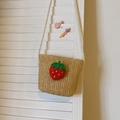 Kids' beige straw crossbody bag with a 3D red strawberry patch and white shoulder strap - Khaki Strawberry