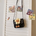 Black PU leather mini crossbody bag for girls featuring a 3D yellow plush flower accent - Black