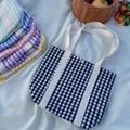 Checkered canvas kids tote bag collection in multiple colors on a summer picnic layout - Black