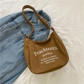 Brown canvas crossbody bag with white typography print and adjustable strap for kids - Brown