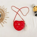 Red quilted heart-shaped crossbody bag with gold clover logo and fuzzy white pompom - Red