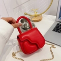 Chic red mini heart-shaped handbag with wavy edge flap and gold chain strap for kids - Red