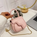 Mini light pink crossbody bag with 3D lava heart design and gold chain strap - Pink