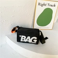 Borsa a tracolla per bambini in nylon nero con scritta BAG bianca e dettaglio arancione - Nero