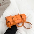 Chic vibrant orange rectangular handbag with textured faux leather and gunmetal hardware - Orange