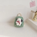 Green canvas toddler backpack featuring a cute white plush puppy doll with red scarf - Green