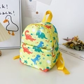 Linda mochila verde para niños con patrones de dinosaurios y bolsillo delantero - Amarillo